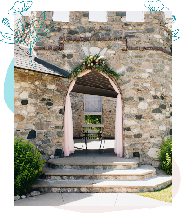 stone Wedding ceremony arch with florals