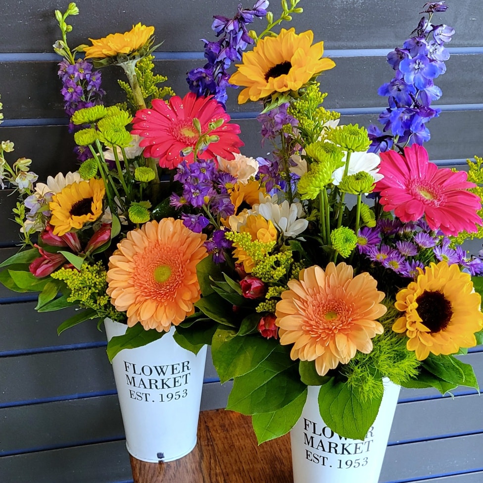 colorful daisy and sunflower floral arrangements