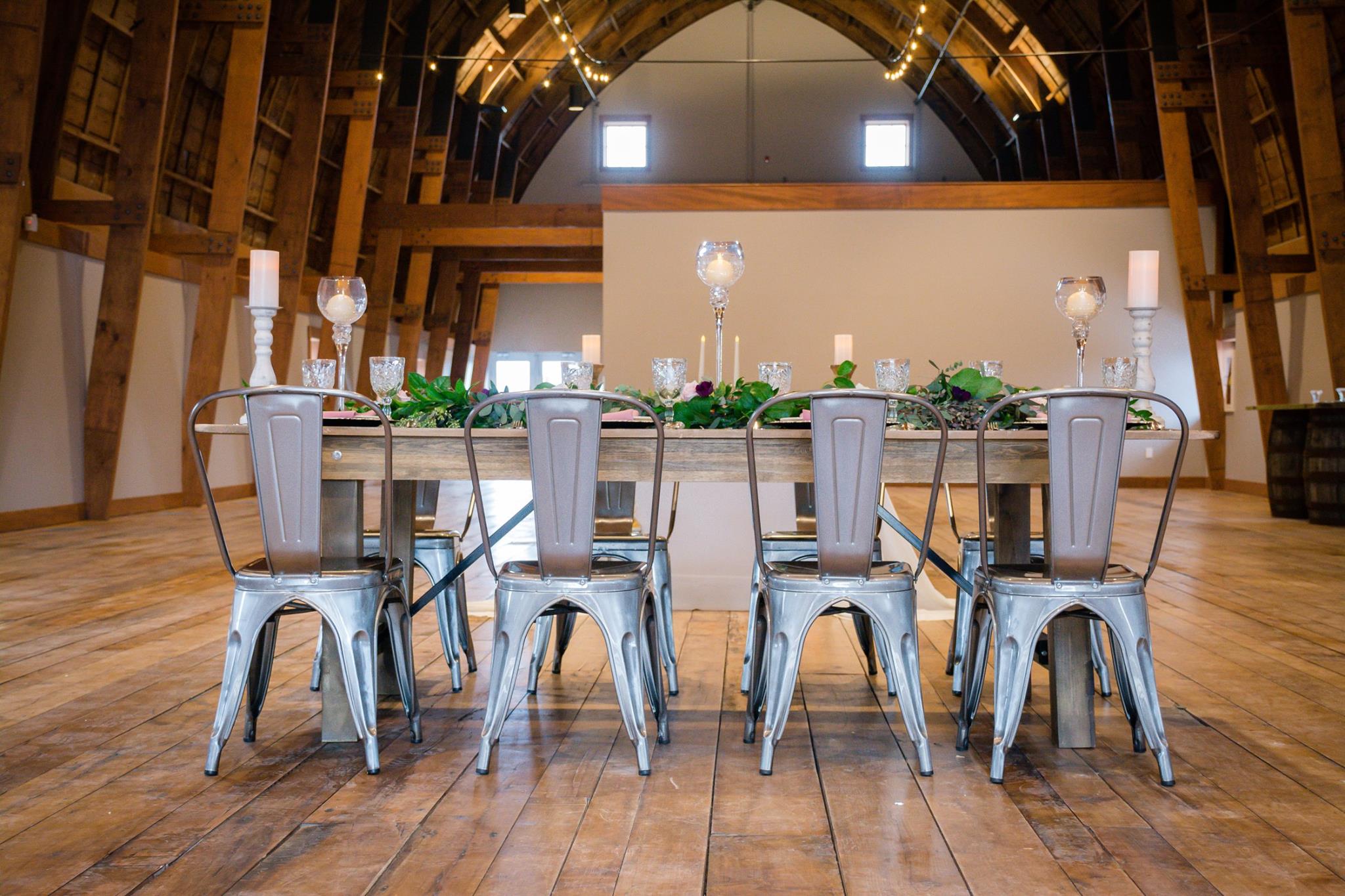 metal chairs at wedding reception table