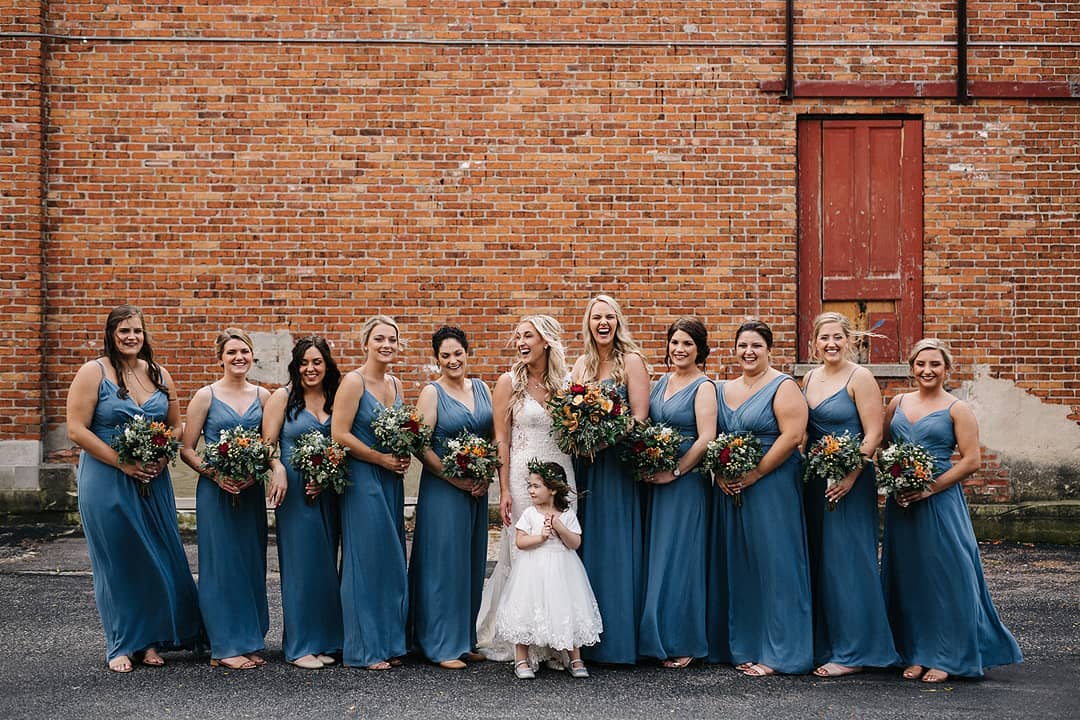 bride with bridesmaids in slate blue bridesmaids gowns