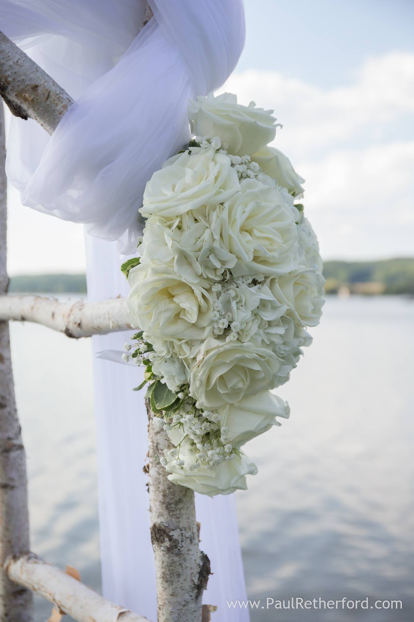 white wedding ceremony flowers