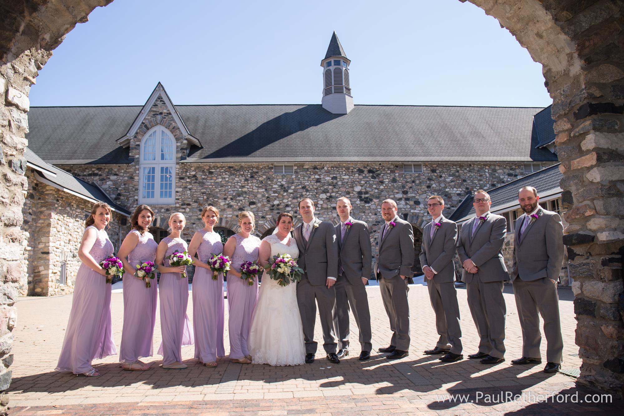 bridal party in lavender dresses and grey tuxes