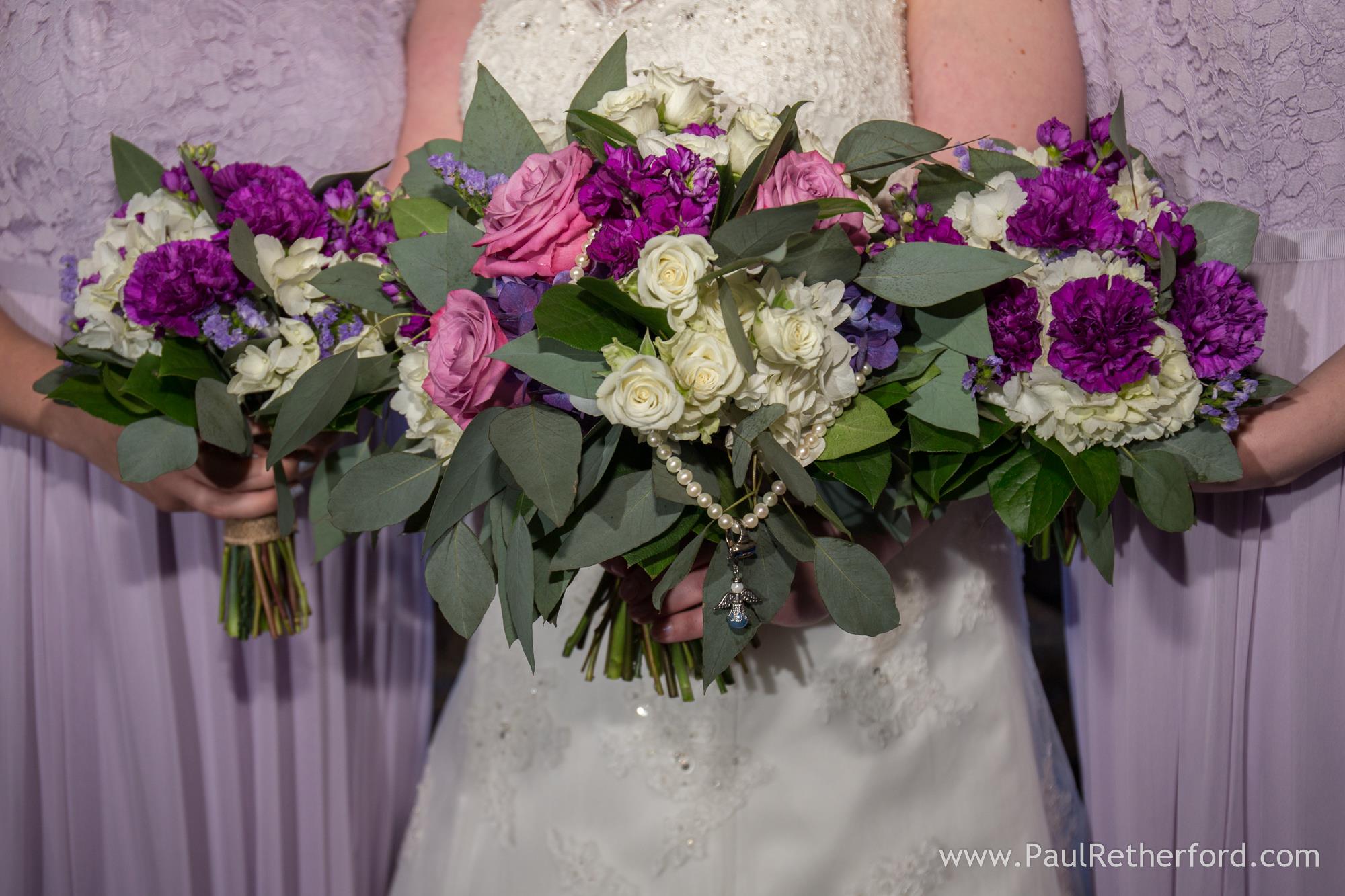 purple and white wedding bouquets