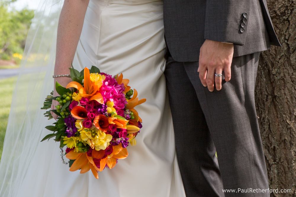 vibrant pink, yellow, and orange bridal bouquet