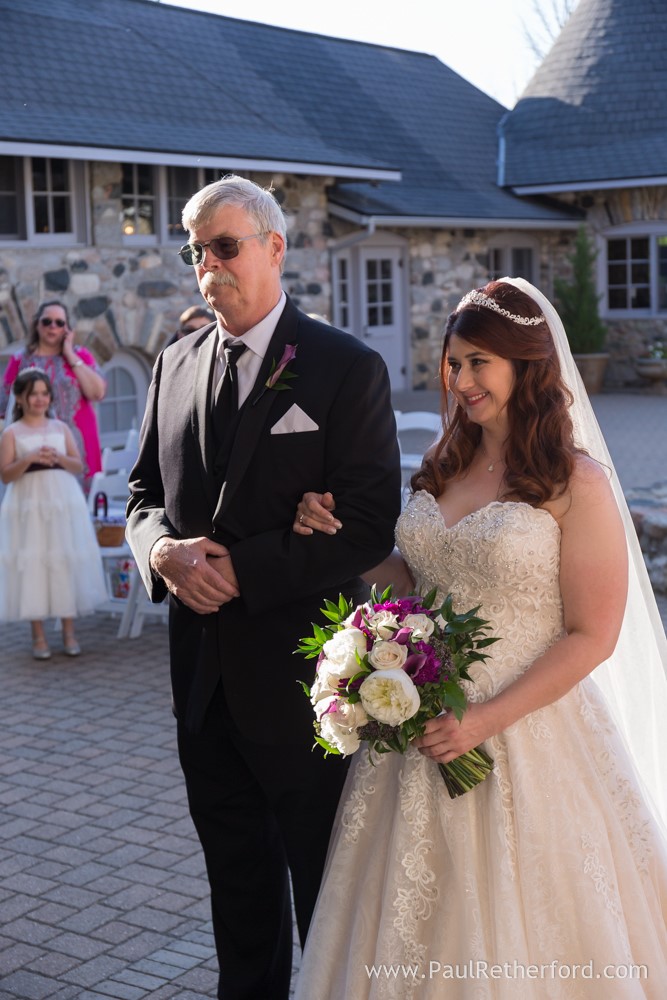 father walking bride down aisle